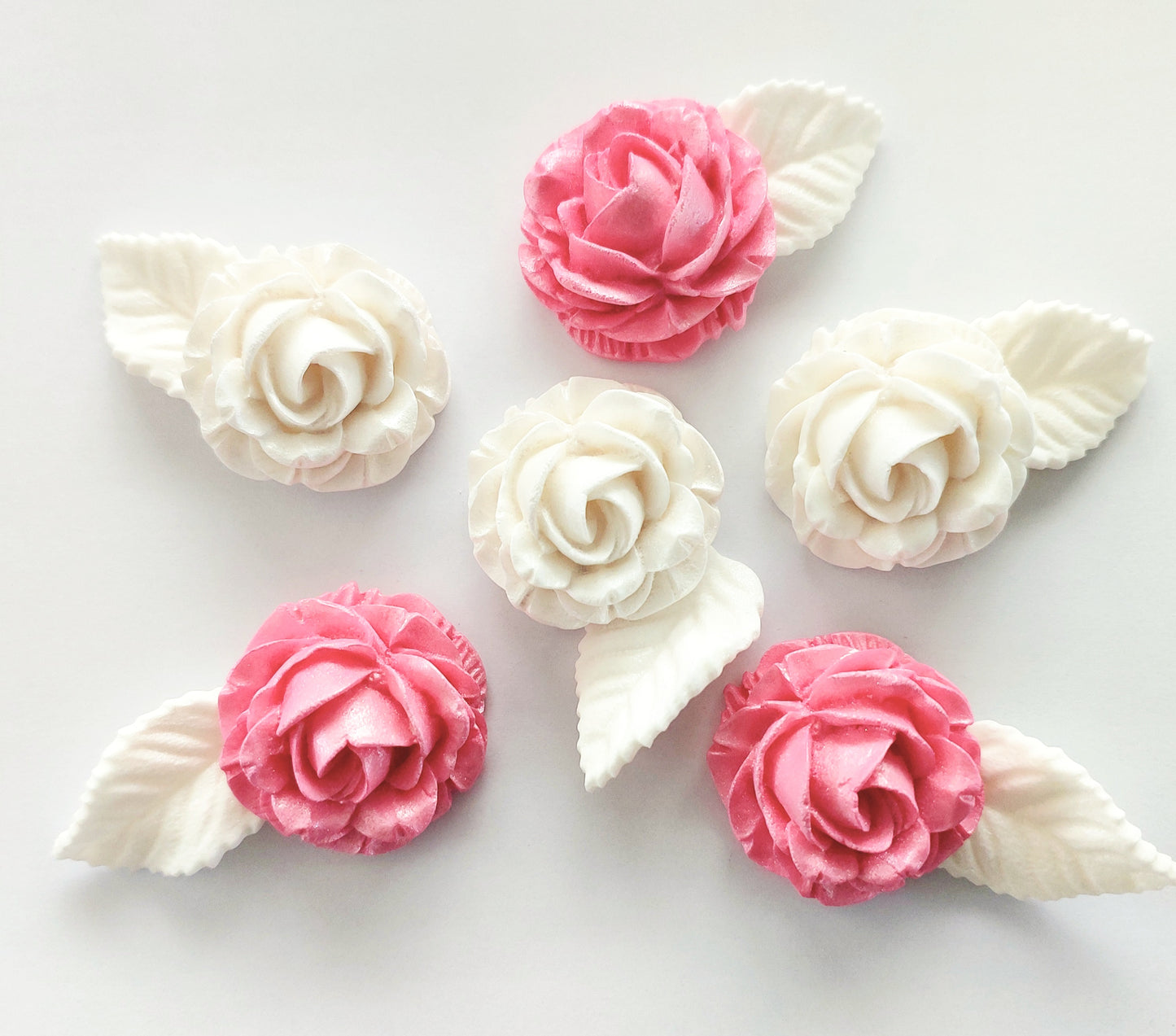 Pink and white roses and leaves. Edible fondant icing cake decorations / topper.