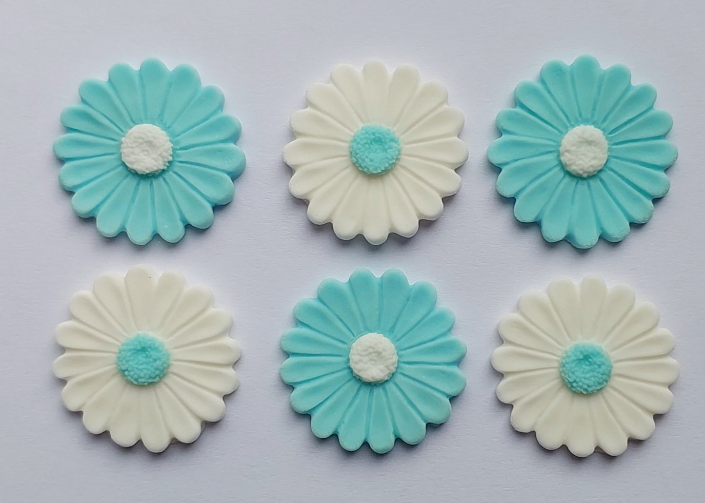 White and pastel blue daisies, edible fondant icing decorations by Cake Candy NZ