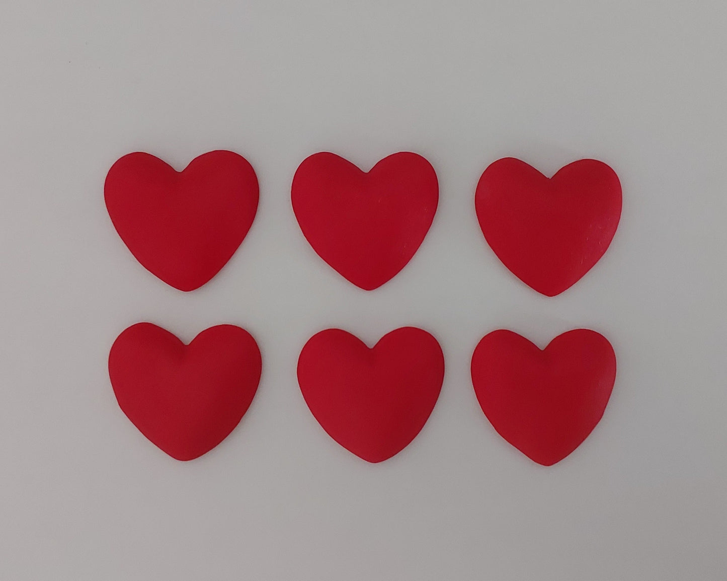 Six red hearts, edible fondant icing decorations by Cake Candy NZ
