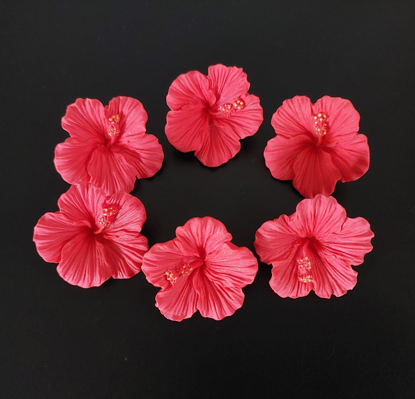 Six tropical hibiscus flowers in red colour. Edible fondant icing decorations by Cake Candy NZ