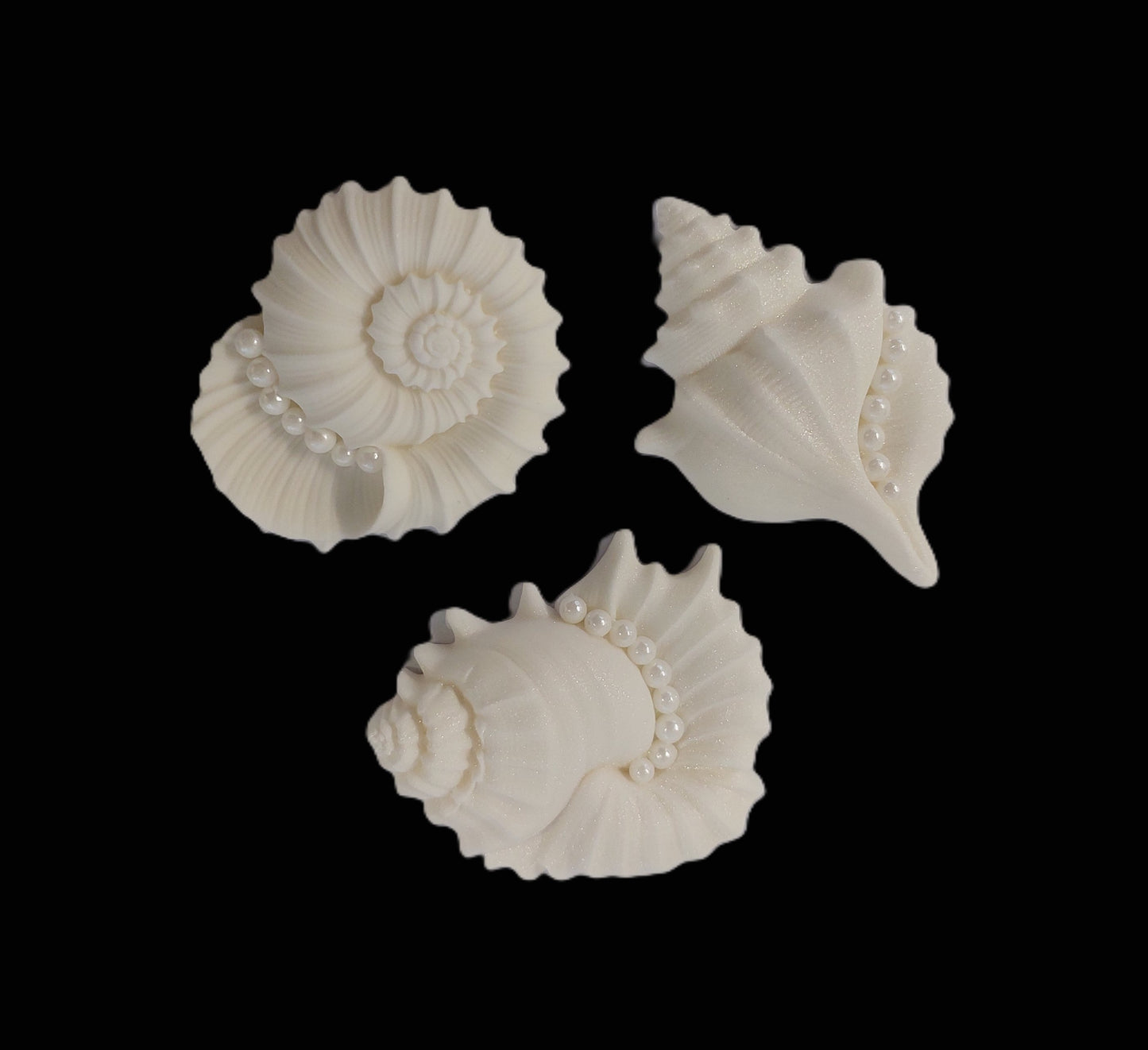 Three large white decorative shells with pearl accents, edible fondant icing decorations by Cake Candy NZ
