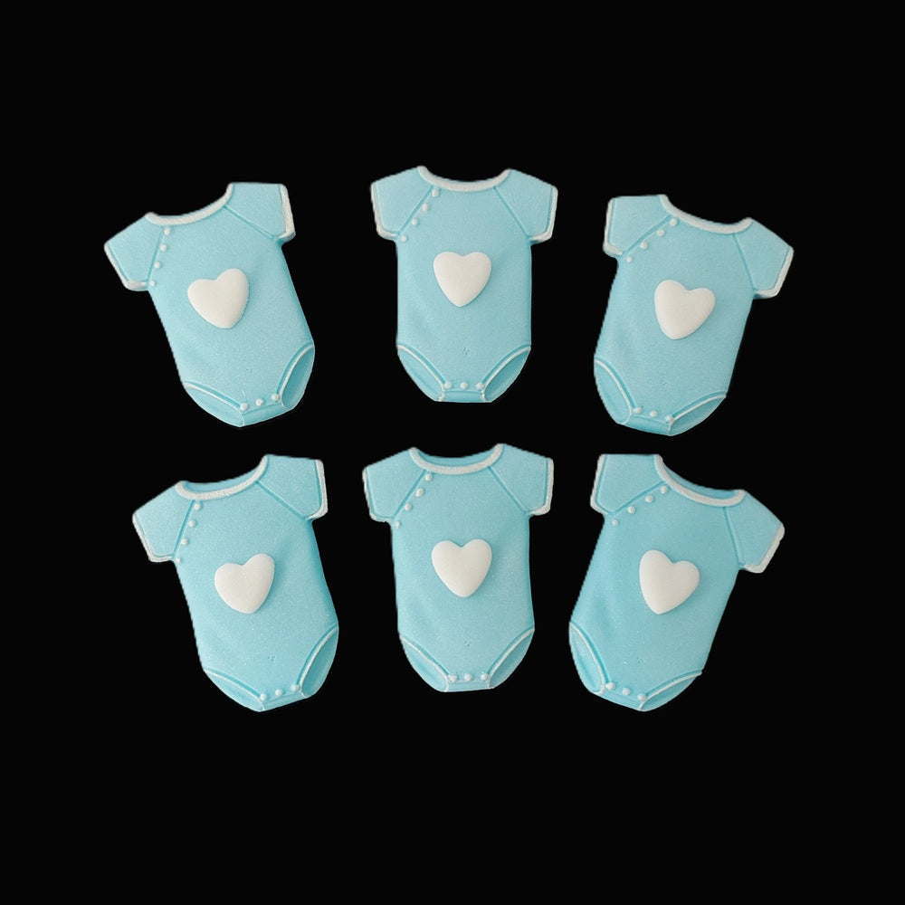 Six blue baby onesies / vests with white hearts. Edible fondant icing decorations by Cake Candy NZ.