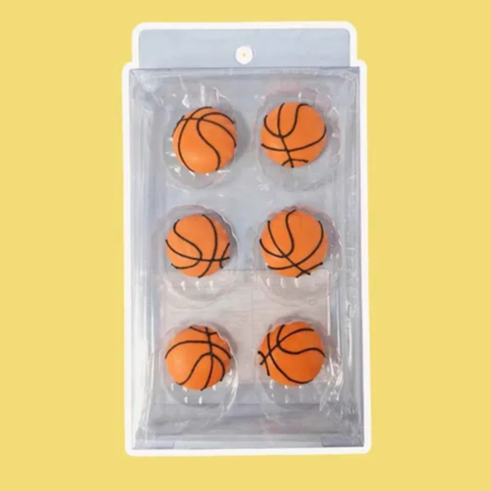 six pieces of royal icing orange baseball cake decorations.