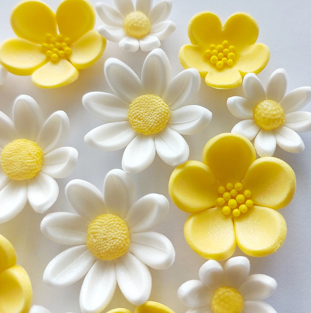 Close up of yellow and white buttercups and daisies, edible fondant icing decorations by Cake Candy NZ