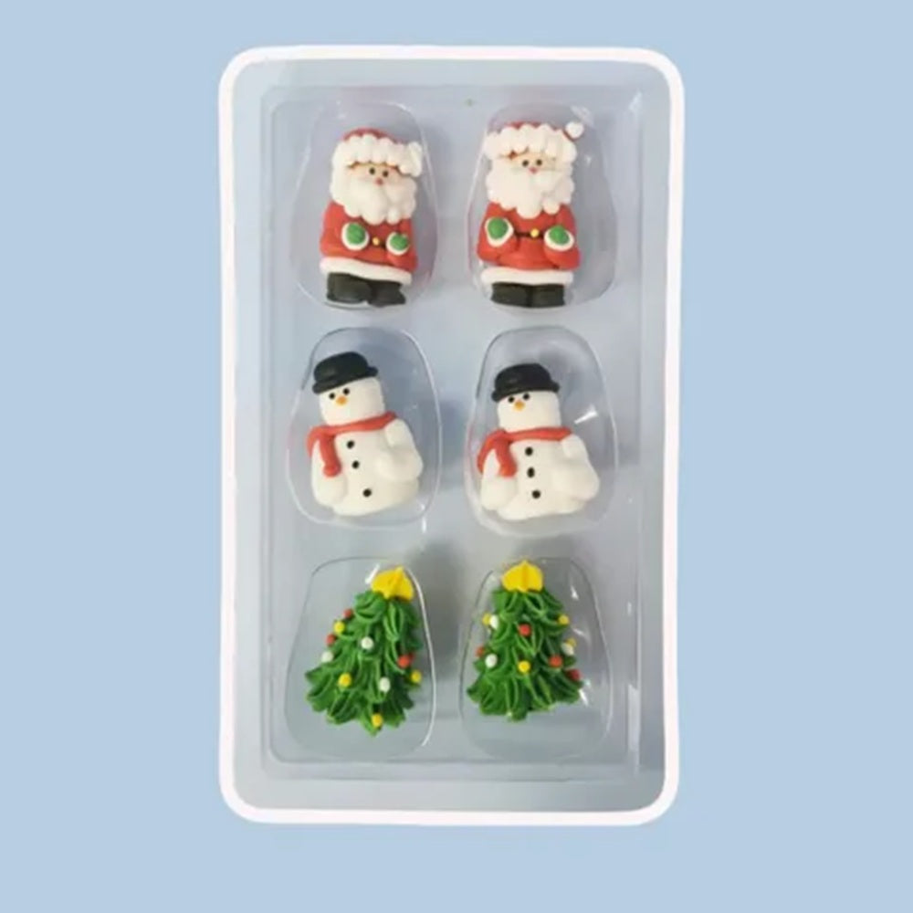 Set of Christmas-themed cake decorations including Santa Claus, snowmen, and trees in a packaging tray.