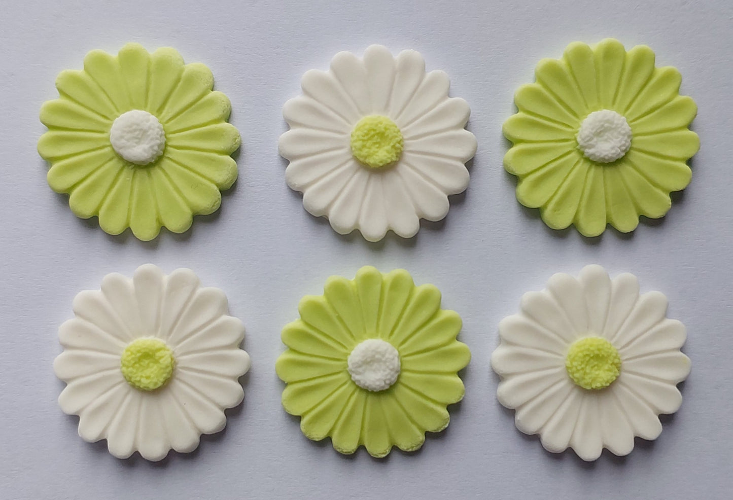 White and pastel green daisies, edible fondant icing decorations by Cake Candy NZ