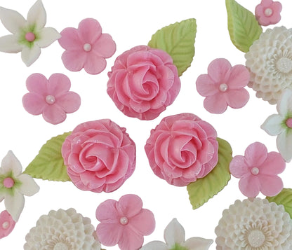 Close up of flower arrangement with dahlias, roses and leaves in pink, white and green colours. Edible fondant icing decorations by Cake Candy NZ
