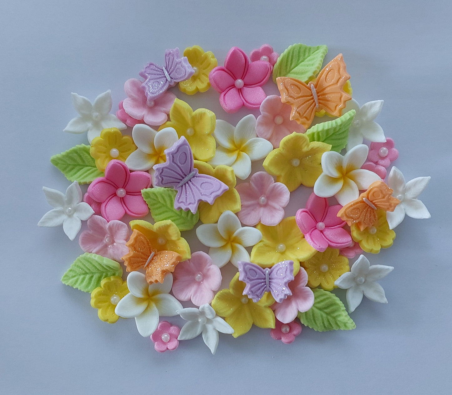 Colourful assortment of flowers and butterflies, edible fondant icing decorations by Cake Candy NZ
