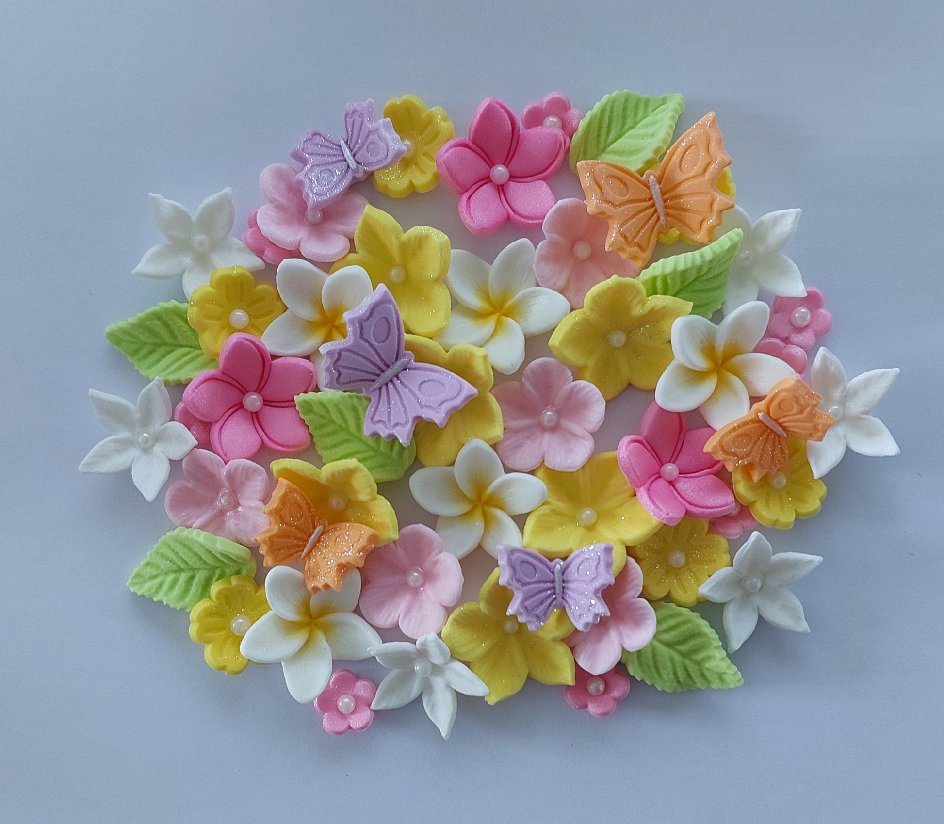 Colourful assortment of flowers and butterflies, edible fondant icing decorations by Cake Candy NZ