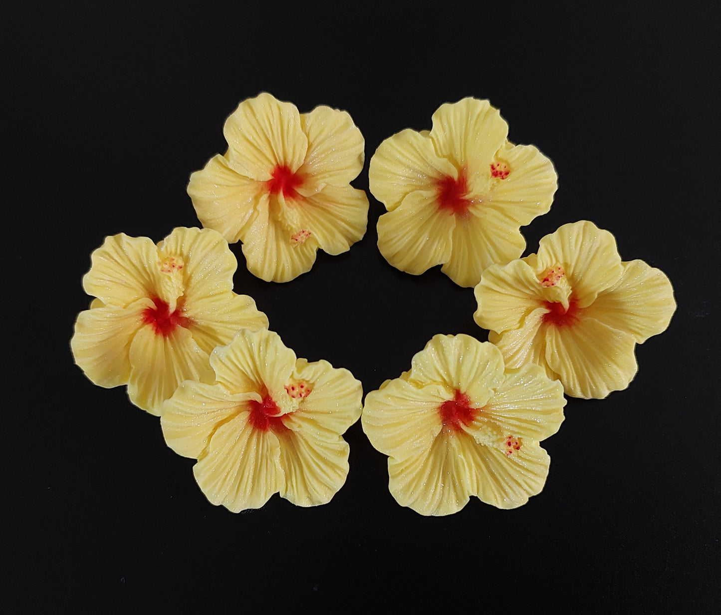 Six yellow tropical hibiscus flowers. Edible fondant icing decorations by Cake Candy NZ