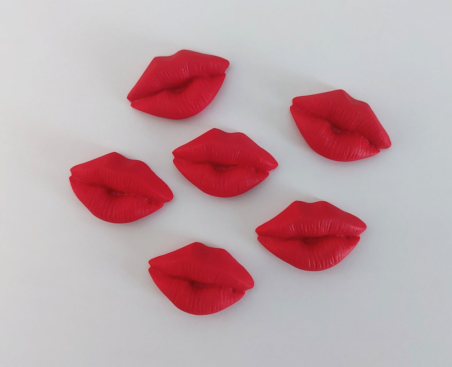 Six red lips, edible fondant icing decorations by Cake Candy NZ