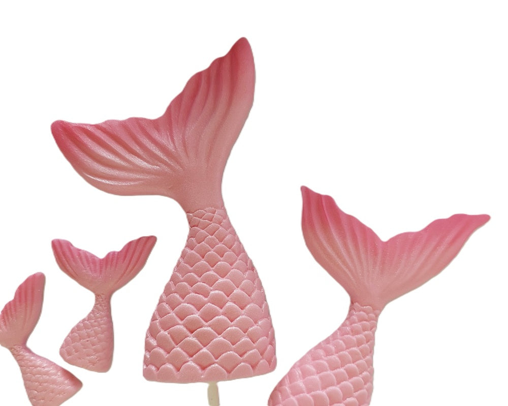 Set of six pink mermaid tails in different sizes. Edible fondant decorations by Cake Candy NZ.