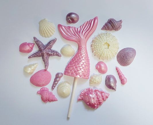 Chocolate mermaid tail, shells and starfish in pink, lilac and cream colours. Edible cake decorations by Cake Candy NZ