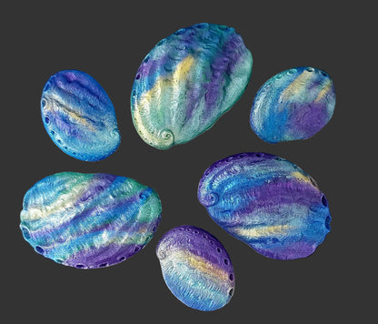 Paua shells blues, greens. purples and gold shimmer. Edible fondant decorations by Cake Candy NZ