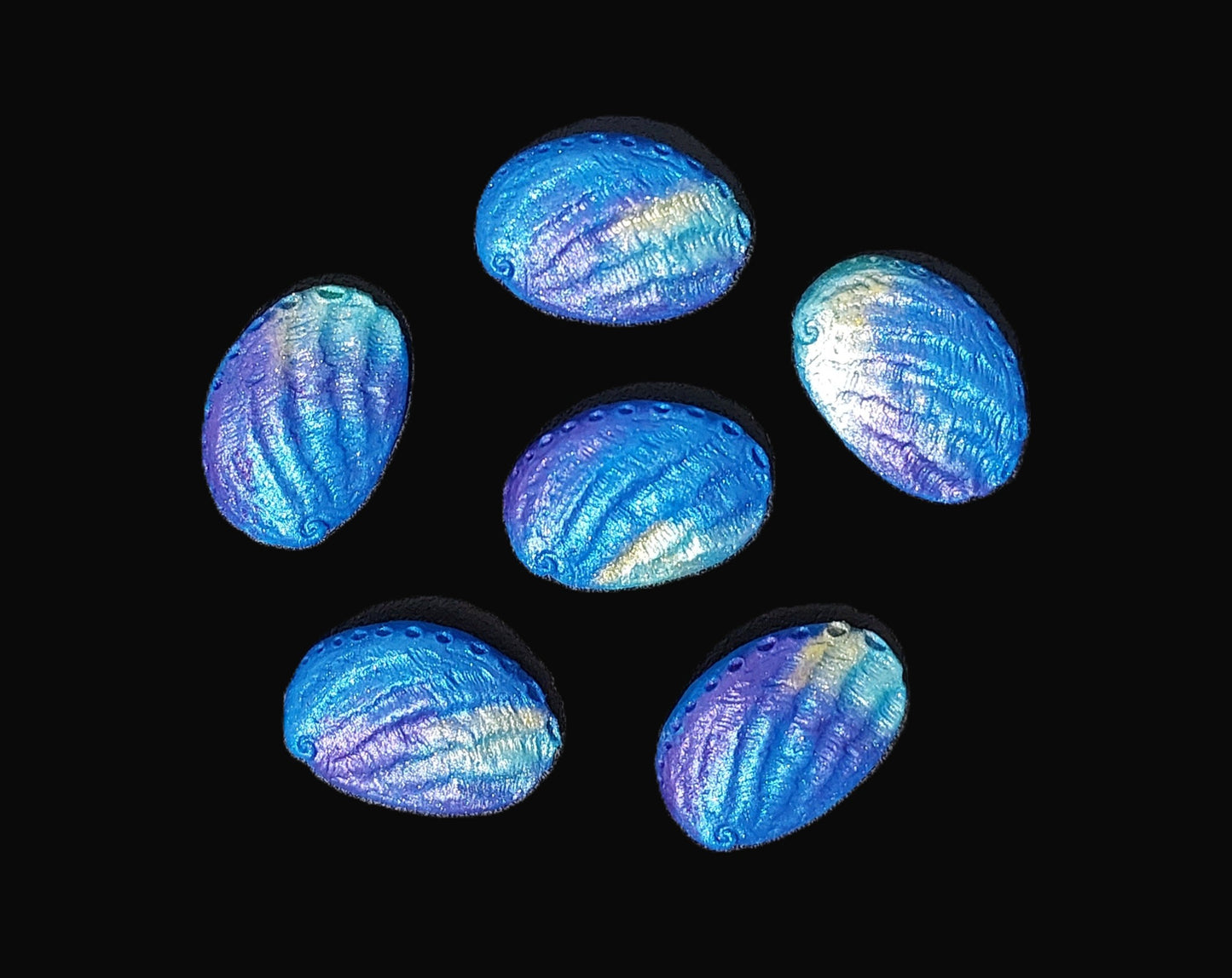 six paua shells blue, purple and aqua. Edible fondant cake decorations by Cake Candy NZ