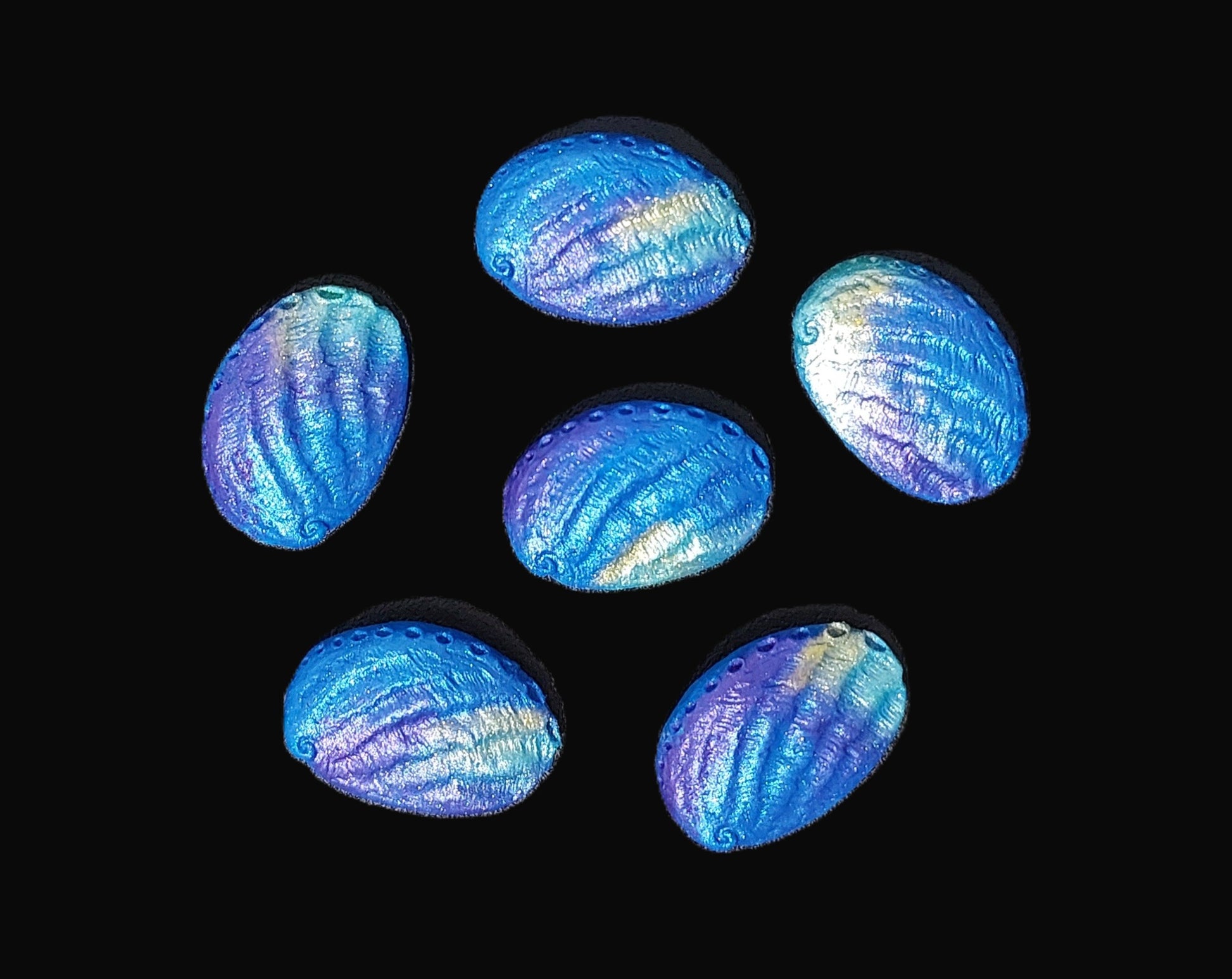 six paua shells blue, purple and aqua. Edible fondant cake decorations by Cake Candy NZ