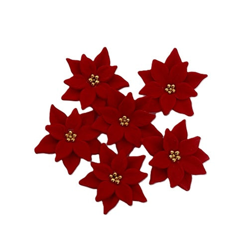 Six edible red fondant poinsettia flowers with small gold bead centers, arranged on a plain white background. By Cake Candy NZ