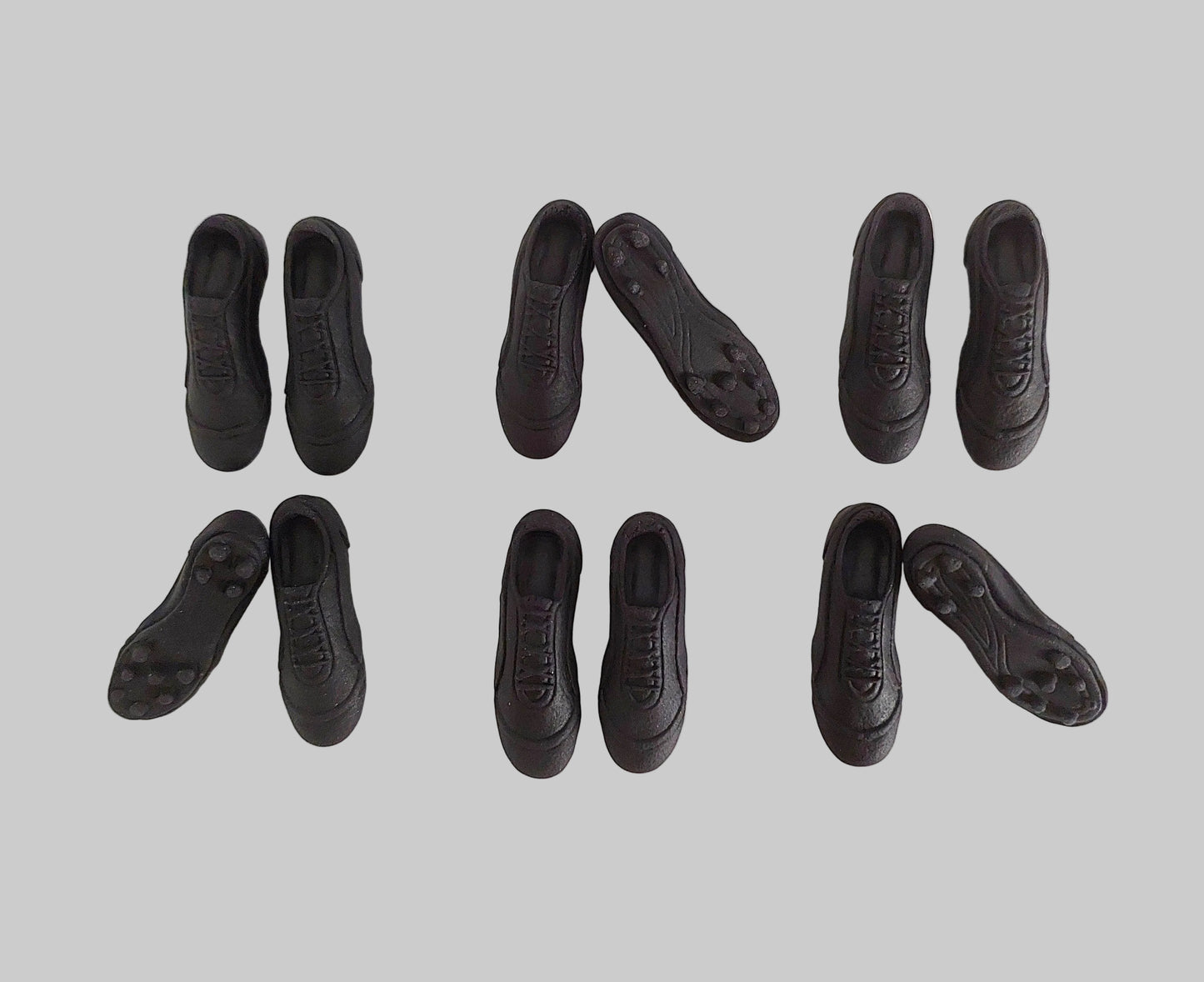 Black football, soccer, rugby boots, edible fondant icing decorations by Cake Candy NZ