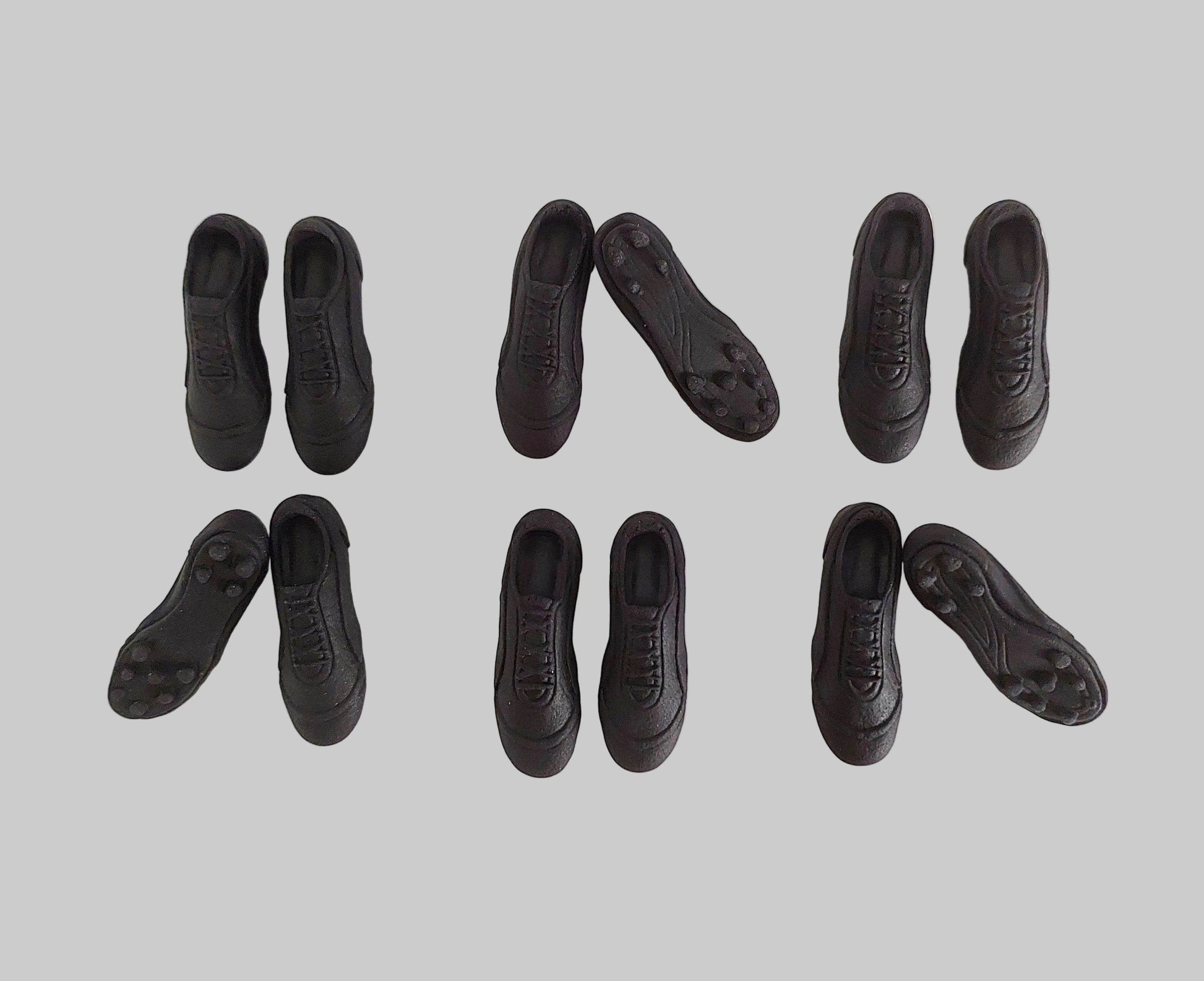 Black football, soccer, rugby boots, edible fondant icing decorations by Cake Candy NZ