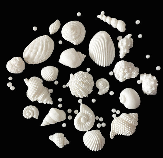 A set of 20 small white fondant icing shells plus sugar pearls