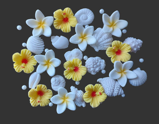 Small shells and tropical flowers in yellow and white. Edible fondant icing decorations by Cake Candy NZ