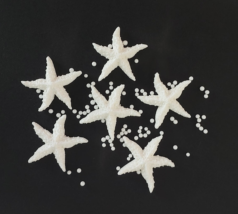 six white starfish, edible fondant icing decorations with sugar pearls by Cake Candy NZ
