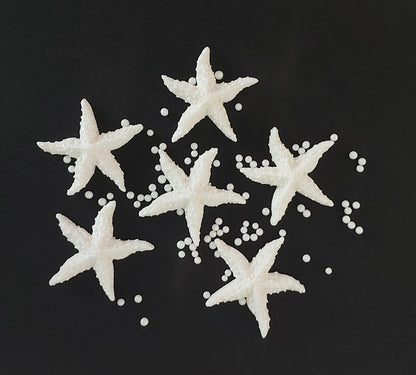 six white starfish, edible fondant icing decorations with sugar pearls by Cake Candy NZ