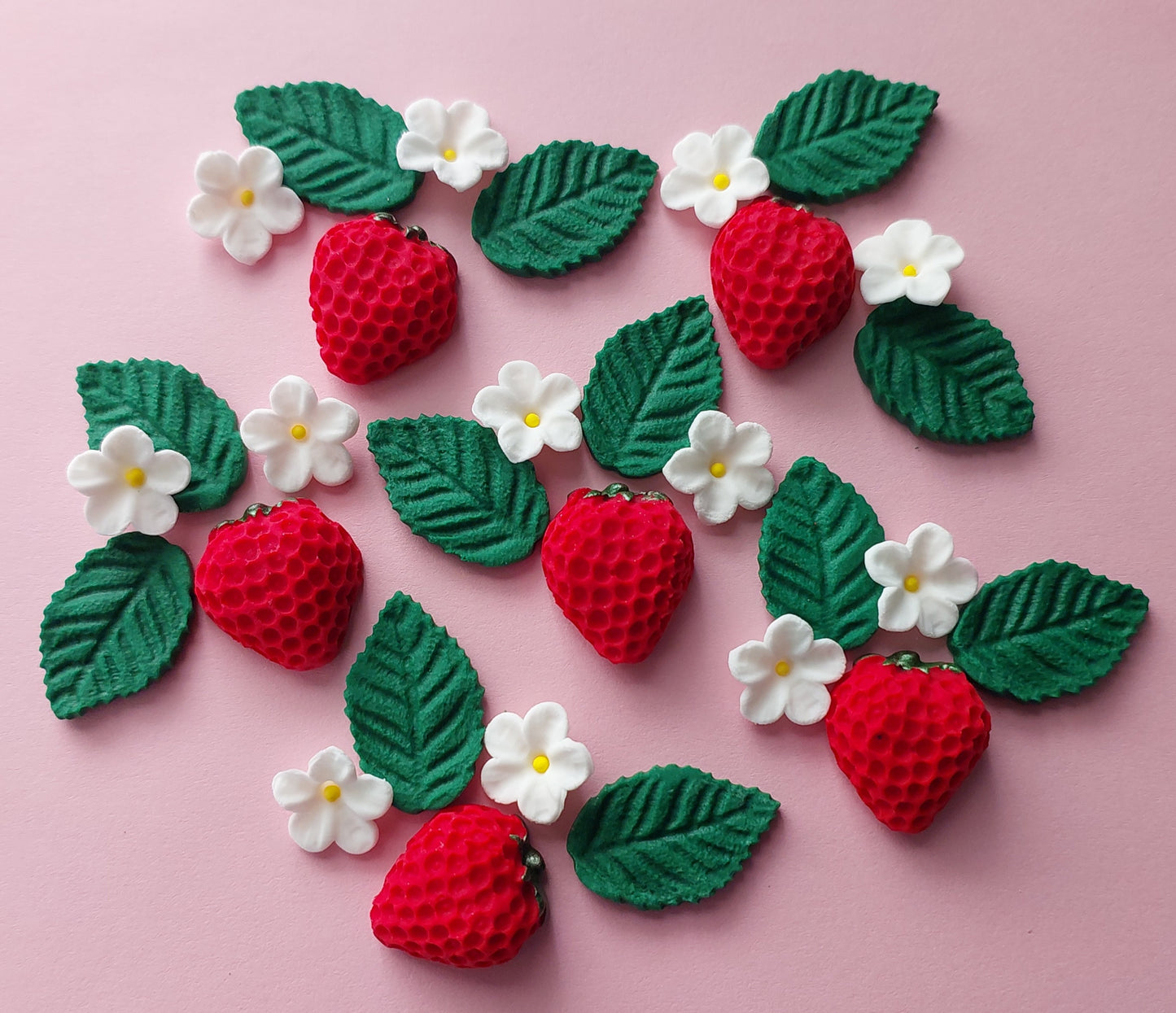 Strawberries, leaves and mini blossoms. Edible fondant icing decorations by Cake Candy NZ