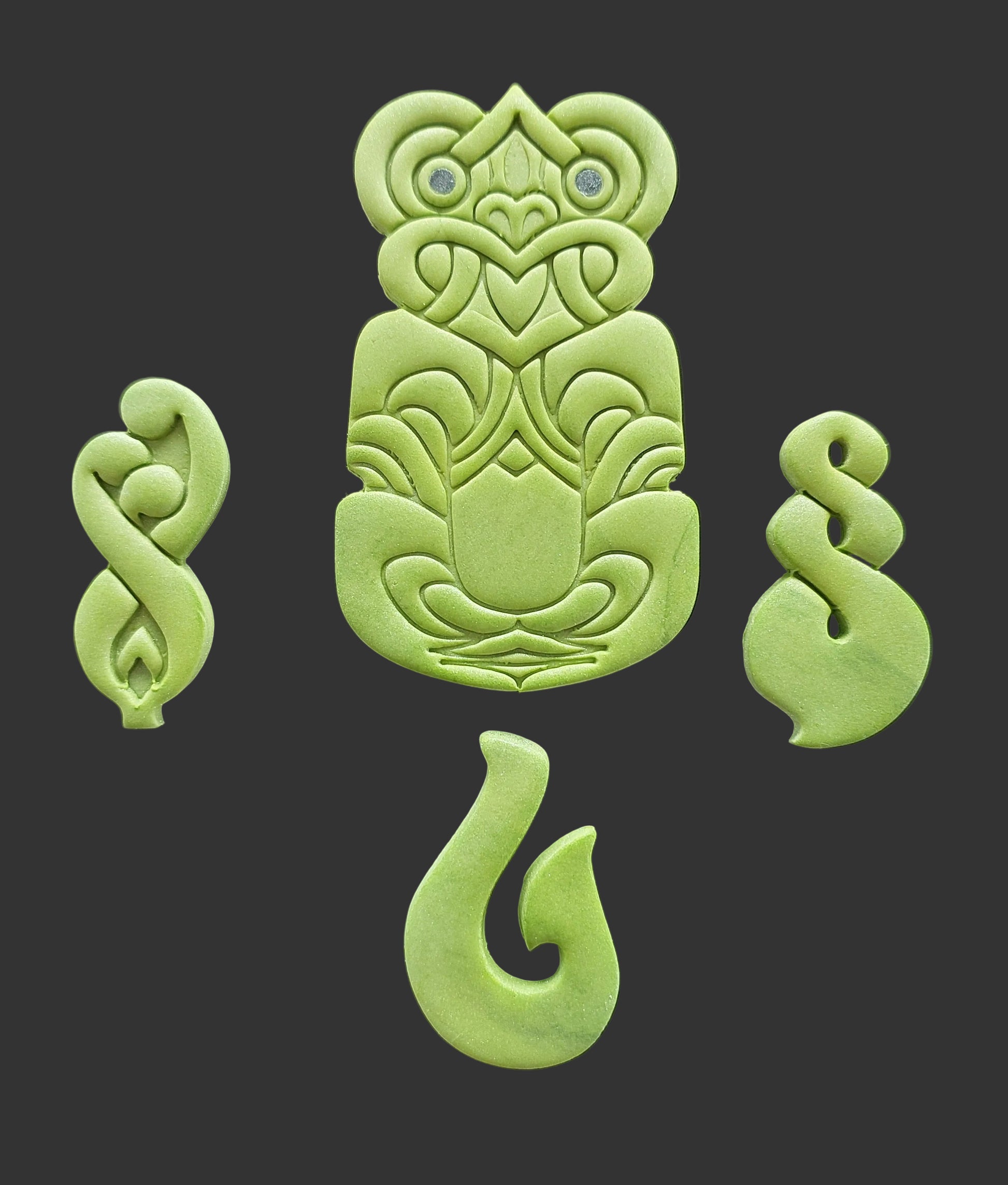 Green Tiki and Maori symbols, edible fondant icing decorations by Cake Candy NZ