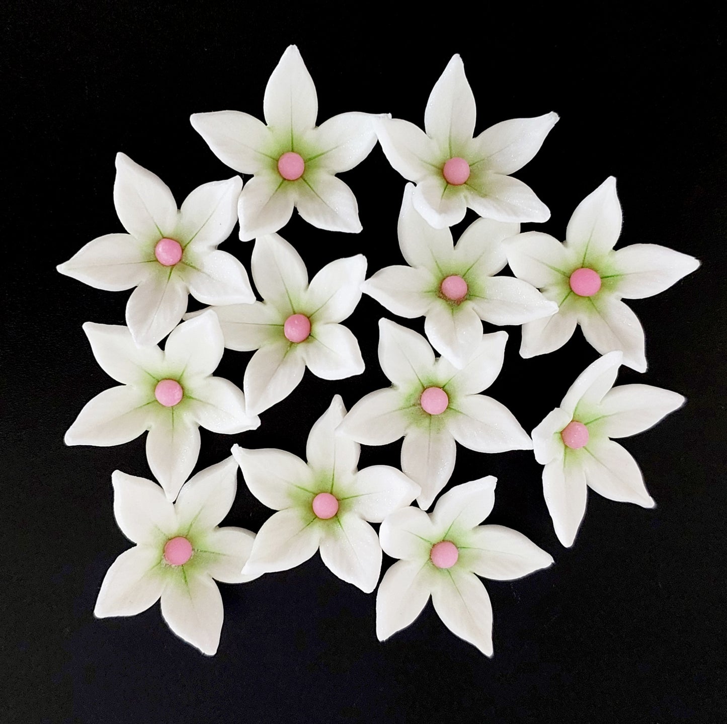 Set of 12 star shaped flowers with green and pink centres, edible fondant icing decorations by Cake Candy NZ